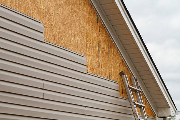 Professional Siding Installation technician working in White Stone, VA
